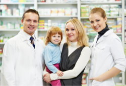 Mother and daughter together with two pharmacists